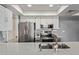 Modern kitchen features stainless appliances, white cabinets, and gray countertops at 520 N Stapley Dr # 256, Mesa, AZ 85203