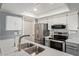 Bright kitchen features stainless steel appliances, updated cabinets, and a view of the sink and countertops at 520 N Stapley Dr # 256, Mesa, AZ 85203