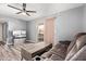 Cozy living room with a plush sofa, wood-look floors, and sliding glass door to patio at 520 N Stapley Dr # 256, Mesa, AZ 85203