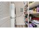 Well-organized pantry with shelving and a stackable washer and dryer at 520 N Stapley Dr # 256, Mesa, AZ 85203