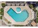 Aerial view of community pool and spa with surrounding lounge chairs at 520 N Stapley Dr # 256, Mesa, AZ 85203
