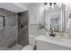 Modern bathroom featuring a marble shower and stylish vanity at 5232 E Dodge St, Mesa, AZ 85205