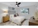 Bedroom featuring a plush bed, elegant decor, and large windows at 5232 E Dodge St, Mesa, AZ 85205