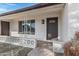Inviting front porch with a decorative stone pathway and modern front door with glass inserts at 5232 E Dodge St, Mesa, AZ 85205