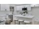 Contemporary kitchen boasting white cabinets, stainless steel appliances, and a sleek design at 5232 E Dodge St, Mesa, AZ 85205