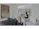 Open-concept living room featuring a dining area and abundant natural light at 5232 E Dodge St, Mesa, AZ 85205