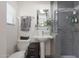 Bathroom with walk in shower and floating shelves at 530 W Almeria Rd, Phoenix, AZ 85003