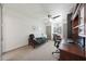 Spacious bedroom with futon, desk, and neutral carpeting at 530 W Almeria Rd, Phoenix, AZ 85003
