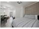 Bedroom with striped bedding and stone tile flooring at 530 W Almeria Rd, Phoenix, AZ 85003