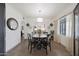 Cozy dining room featuring a round wooden table, stylish chairs, and a modern light fixture at 530 W Almeria Rd, Phoenix, AZ 85003