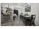 Kitchen and eat in dining area with stainless steel appliances and stone tile flooring at 530 W Almeria Rd, Phoenix, AZ 85003