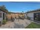 Outdoor patio area with dining table and chairs, lounge seating, and a shade awning at 530 W Almeria Rd, Phoenix, AZ 85003