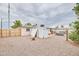 Fully fenced backyard featuring desert landscaping, a storage shed and an outdoor living area for enjoying the outdoors at 5410 E University Dr, Mesa, AZ 85205
