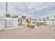 Spacious backyard with patio seating, storage shed, and xeriscape landscaping providing a low-maintenance outdoor area at 5410 E University Dr, Mesa, AZ 85205