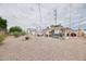 Inviting backyard with outdoor furniture, hot tub, shed, and desert landscaping for a relaxing outdoor experience at 5410 E University Dr, Mesa, AZ 85205