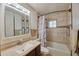 Traditional bathroom with a bathtub and shower combination, plus a matching vanity at 5410 E University Dr, Mesa, AZ 85205