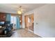 Bonus room with brick siding, a sliding glass door, and a desk at 5410 E University Dr, Mesa, AZ 85205