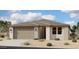 Charming single-story home with a two-car garage and low maintenance desert landscaping at 5515 W Piedmont Rd, Laveen, AZ 85339