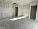 View of an unfinished interior featuring newly installed drywall and framing and rough concrete floors at 5515 W Piedmont Rd, Laveen, AZ 85339