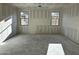 View of an unfinished interior featuring newly installed drywall and framing and rough concrete floors at 5515 W Piedmont Rd, Laveen, AZ 85339