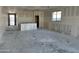 Unfinished living room with drywall and utility connections shows layout with bright windows and an open design at 5515 W Piedmont Rd, Laveen, AZ 85339