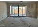 Unfinished room with sliding glass doors opening to a patio, showing building's potential for indoor-outdoor living at 5515 W Piedmont Rd, Laveen, AZ 85339