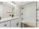 Bright bathroom with white cabinets, quartz countertops, matte black hardware and a shower/tub combo at 5526 N 77Th Way, Scottsdale, AZ 85250