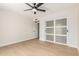 This bedroom is bright and features wood-look floors, updated closet doors, and a ceiling fan at 5526 N 77Th Way, Scottsdale, AZ 85250