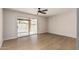 Bedroom with sliding glass doors to outdoor patio and vinyl plank flooring at 5526 N 77Th Way, Scottsdale, AZ 85250