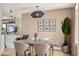 Chic dining room with modern lighting, elegant decor, and seating for six at 5526 N 77Th Way, Scottsdale, AZ 85250