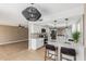 Bright kitchen with counter seating, pendant lighting, and stainless steel appliances at 5526 N 77Th Way, Scottsdale, AZ 85250