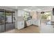 Modern kitchen with white cabinets, stainless steel appliances, and outdoor views at 5526 N 77Th Way, Scottsdale, AZ 85250