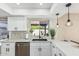 Updated kitchen with stainless steel dishwasher and sink under window at 5526 N 77Th Way, Scottsdale, AZ 85250