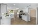 Bright kitchen featuring white cabinetry, stainless steel appliances, and pendant lighting at 5526 N 77Th Way, Scottsdale, AZ 85250