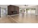 Bright living room featuring hardwood floors, electric fireplace, and sliding glass doors at 5526 N 77Th Way, Scottsdale, AZ 85250