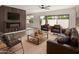 Inviting living room with a modern fireplace, stylish furniture, and a ceiling fan at 5526 N 77Th Way, Scottsdale, AZ 85250