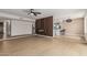 Spacious living room with decorative wall and pass-through to kitchen and dining area at 5526 N 77Th Way, Scottsdale, AZ 85250