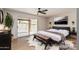 Comfortable main bedroom with sliding glass doors, a ceiling fan, and modern decor at 5526 N 77Th Way, Scottsdale, AZ 85250