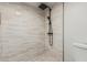 Updated walk-in shower showcasing sleek tile, modern fixtures and a hand-held shower head at 5526 N 77Th Way, Scottsdale, AZ 85250