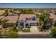 A beautiful home features well-maintained landscaping, a tile roof, and a two-car garage at 567 E Tropical Dr, Casa Grande, AZ 85122