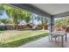 A large backyard features lush green grass and mature landscaping at 567 E Tropical Dr, Casa Grande, AZ 85122