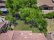 A large backyard with grass and well-maintained trees offers plenty of space for outdoor enjoyment and activities at 567 E Tropical Dr, Casa Grande, AZ 85122
