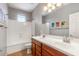 Bathroom features double sinks with tile flooring and shower-tub combo at 567 E Tropical Dr, Casa Grande, AZ 85122