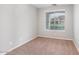 Cozy bedroom with carpet flooring and a large window with blinds at 567 E Tropical Dr, Casa Grande, AZ 85122