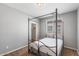 Bedroom features a four poster bed, neutral colors and an open closet at 567 E Tropical Dr, Casa Grande, AZ 85122