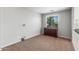 Second-floor bonus room with dresser and a window with backyard views at 567 E Tropical Dr, Casa Grande, AZ 85122