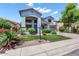 Charming two-story home featuring a landscaped front yard, covered entry, and attached garage at 567 E Tropical Dr, Casa Grande, AZ 85122