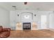 Living room fireplace with mantel, built-in shelves, and carpet flooring at 567 E Tropical Dr, Casa Grande, AZ 85122
