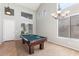 Spacious game room features a pool table, high ceilings, and lots of natural light at 567 E Tropical Dr, Casa Grande, AZ 85122