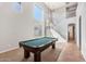 Spacious game room features a pool table, high ceilings, and lots of natural light at 567 E Tropical Dr, Casa Grande, AZ 85122